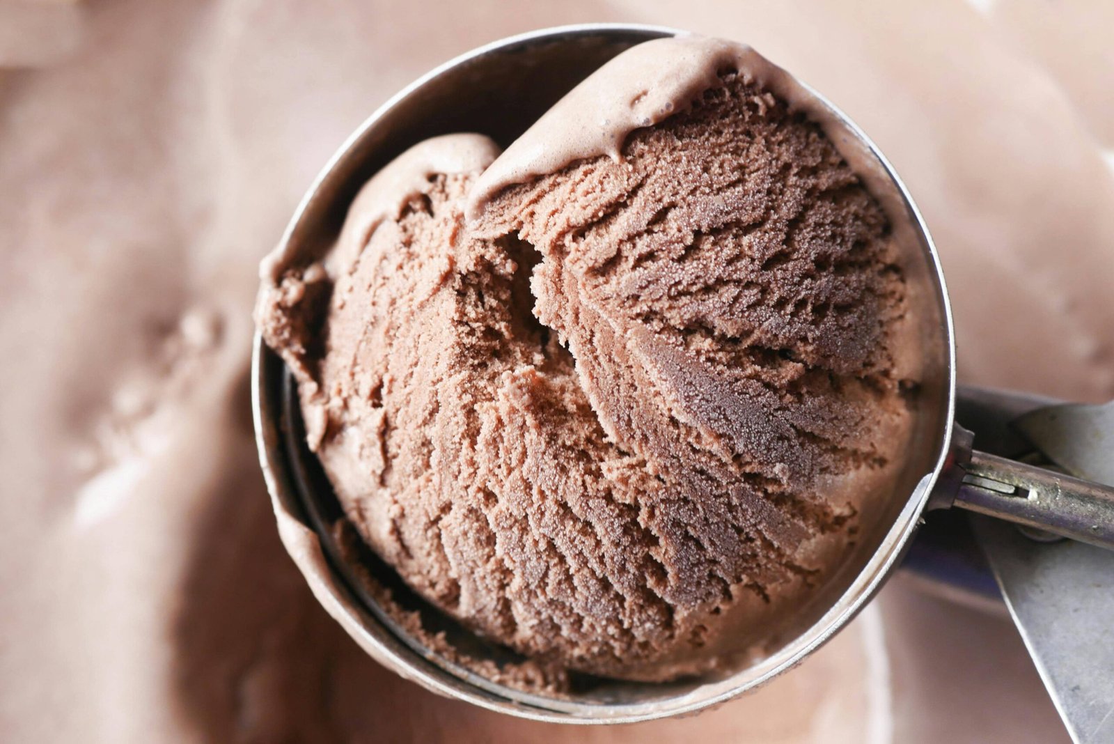 A close-up shot of a scoop of homemade chocolate ice cream, showcasing its creamy texture.