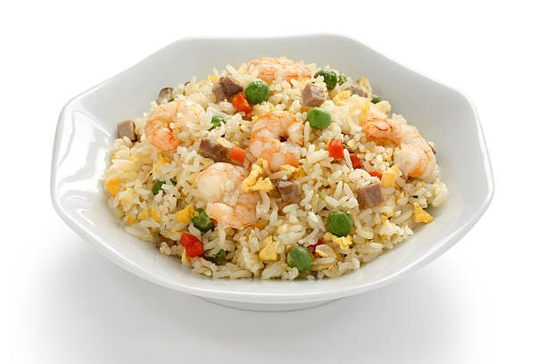 A bowl of Chowking-style chao fan, featuring stir-fried rice mixed with shrimp, diced pork, green peas, scrambled eggs, and colorful vegetables, showcasing a delicious and easy chao fan recipe.