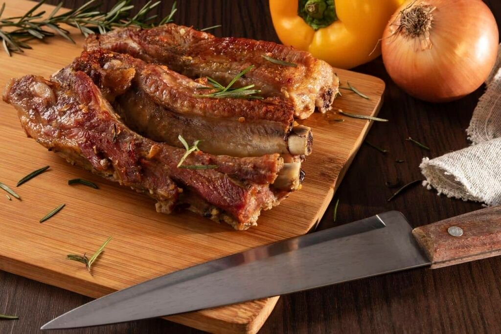 A succulent serving of embutido, a traditional Filipino meatloaf, garnished with fresh rosemary and served on a wooden cutting board, ideal for showcasing a flavorful embutido recipe.