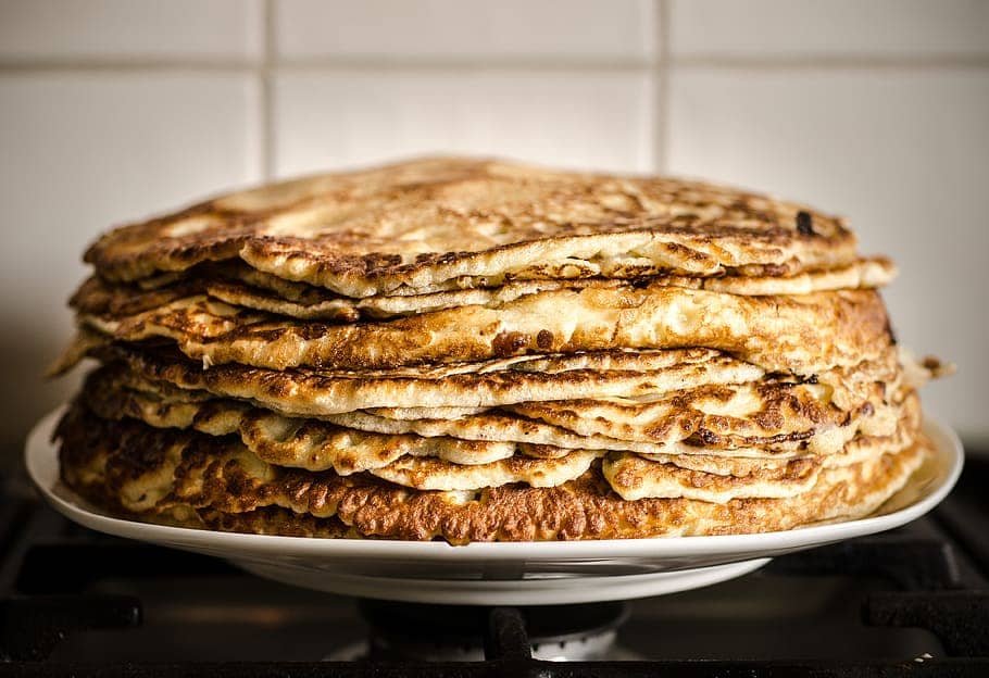 A stack of golden-brown, crispy Filipino Salvaro, showing the delicious layers of this traditional coconut-flavored flatbread.