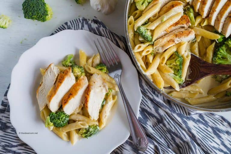 A plate of Chicken Broccoli pasta with grilled chicken slices and creamy sauce.