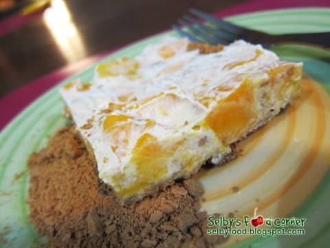 A slice of Mango Bravo refrigerator cake served on a plate.