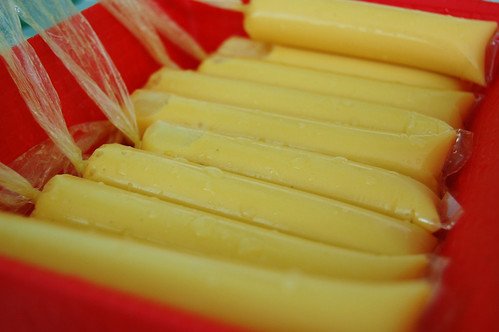 Frozen Mango Graham ice candy in plastic wrappers.